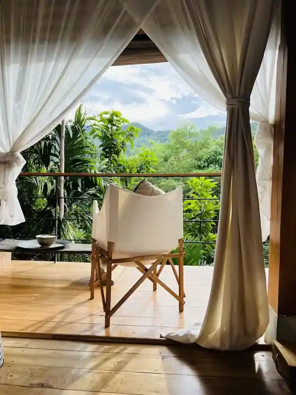 Boutique veranda with curtains and mountain views